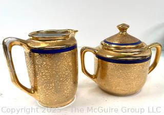 Porcelain Gold Creamer & Covered Sugar Bowl<br>

<br><br>

Removal Options:<br><br> Sat (Nov 8) & Sun (Nov 9) 11-3pm, 56 Scotch Hill Rd., Cambridge NY 12816<br><br>

Sat (Nov 15) 12-2pm, TMG Warehouse, 2800 Juniper St., Fairfax, VA 22031<br><br>

Request Shipping (david@themcguiregroupllc.com)