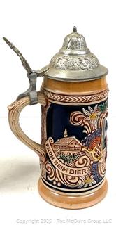 Two (2) Steins and a Figurine<br>

<br><br>

Removal Options:<br><br> Sat (Nov 8) & Sun (Nov 9) 11-3pm, 56 Scotch Hill Rd., Cambridge NY 12816<br><br>

Sat (Nov 15) 12-2pm, TMG Warehouse, 2800 Juniper St., Fairfax, VA 22031<br><br>

Request Shipping (david@themcguiregroupllc.com)