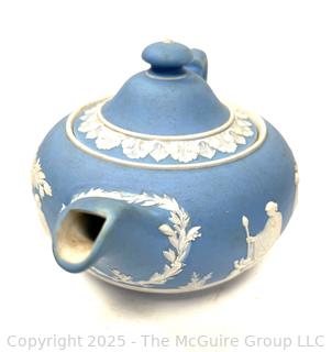 English Wedgwood Blue Jasperware Teapot<br>

<br><br>

Removal Options:<br><br> Sat (Nov 8) & Sun (Nov 9) 11-3pm, 56 Scotch Hill Rd., Cambridge NY 12816<br><br>

Sat (Nov 15) 12-2pm, TMG Warehouse, 2800 Juniper St., Fairfax, VA 22031<br><br>

Request Shipping (david@themcguiregroupllc.com) 