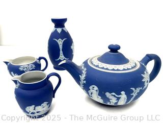 Four (4) Pieces Cobalt Blue English Wedgwood Jasperware Teapot, Creamer, Sugar and Bud Vase<br>

<br><br>

Removal Options:<br><br> Sat (Nov 8) & Sun (Nov 9) 11-3pm, 56 Scotch Hill Rd., Cambridge NY 12816<br><br>

Sat (Nov 15) 12-2pm, TMG Warehouse, 2800 Juniper St., Fairfax, VA 22031<br><br>

Request Shipping (david@themcguiregroupllc.com)