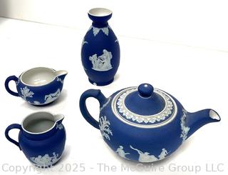 Four (4) Pieces Cobalt Blue English Wedgwood Jasperware Teapot, Creamer, Sugar and Bud Vase<br>

<br><br>

Removal Options:<br><br> Sat (Nov 8) & Sun (Nov 9) 11-3pm, 56 Scotch Hill Rd., Cambridge NY 12816<br><br>

Sat (Nov 15) 12-2pm, TMG Warehouse, 2800 Juniper St., Fairfax, VA 22031<br><br>

Request Shipping (david@themcguiregroupllc.com)