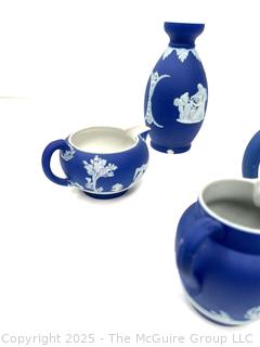Four (4) Pieces Cobalt Blue English Wedgwood Jasperware Teapot, Creamer, Sugar and Bud Vase<br>

<br><br>

Removal Options:<br><br> Sat (Nov 8) & Sun (Nov 9) 11-3pm, 56 Scotch Hill Rd., Cambridge NY 12816<br><br>

Sat (Nov 15) 12-2pm, TMG Warehouse, 2800 Juniper St., Fairfax, VA 22031<br><br>

Request Shipping (david@themcguiregroupllc.com)