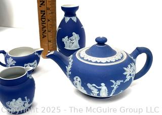 Four (4) Pieces Cobalt Blue English Wedgwood Jasperware Teapot, Creamer, Sugar and Bud Vase<br>

<br><br>

Removal Options:<br><br> Sat (Nov 8) & Sun (Nov 9) 11-3pm, 56 Scotch Hill Rd., Cambridge NY 12816<br><br>

Sat (Nov 15) 12-2pm, TMG Warehouse, 2800 Juniper St., Fairfax, VA 22031<br><br>

Request Shipping (david@themcguiregroupllc.com)