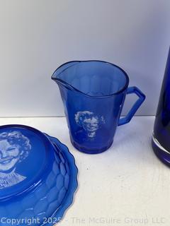 Cobalt Blue Glassware Including Hazel-Atlas Shirley Temple Plate and Mug and Bar Pitcher<br>

<br><br>

Removal Options:<br><br> Sat (Nov 8) & Sun (Nov 9) 11-3pm, 56 Scotch Hill Rd., Cambridge NY 12816<br><br>

Sat (Nov 15) 12-2pm, TMG Warehouse, 2800 Juniper St., Fairfax, VA 22031<br><br>

Request Shipping (david@themcguiregroupllc.com)