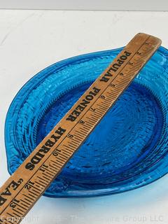 Tiara Indiana Glass Plate Aqua Blue Tray "Give Us This Day Our Daily Bread" 10.5”L x 7”W. Note Chip<br>

<br><br>

Removal Options:<br><br> Sat (Nov 8) & Sun (Nov 9) 11-3pm, 56 Scotch Hill Rd., Cambridge NY 12816<br><br>

Sat (Nov 15) 12-2pm, TMG Warehouse, 2800 Juniper St., Fairfax, VA 22031<br><br>

Request Shipping (david@themcguiregroupllc.com)