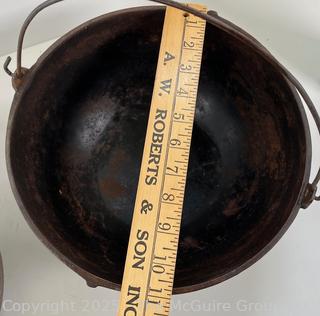 Two (2) Cast Iron Pots w/ Wire Bales for Cooking or Possibly Lead Smelting<br>

<br><br>

Removal Options:<br><br> Sat (Nov 8) & Sun (Nov 9) 11-3pm, 56 Scotch Hill Rd., Cambridge NY 12816<br><br>

Sat (Nov 15) 12-2pm, TMG Warehouse, 2800 Juniper St., Fairfax, VA 22031<br><br>

Request Shipping (david@themcguiregroupllc.com)
