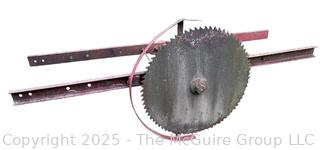Vintage Circular Saw Blade Mounted on Frame That Attaches to a Tractor. Belt Driven.  Diameter of Blade is ___ <br>

<br><br>

Removal Options:<br><br> Sat (Nov 8) & Sun (Nov 9) 11-3pm, 56 Scotch Hill Rd., Cambridge NY 12816<br><br>

Sat (Nov 15) 12-2pm, TMG Warehouse, 2800 Juniper St., Fairfax, VA 22031<br><br>

Request Shipping (david@themcguiregroupllc.com) 