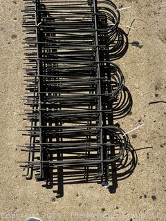 Stack of Metal Garden Fence Panels and Anchor Spikes.  Each Panel Measures 24 x 47"