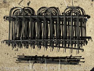 Stack of Metal Garden Fence Panels and Anchor Spikes.  Each Panel Measures 24 x 47"