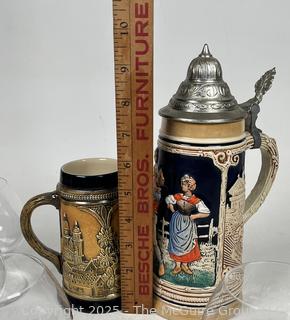 Two (2) German Steins and Five (5) Baccarat Crystal Goblets