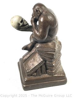 Darwin Monkey with Skull Sculpture
