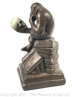 Darwin Monkey with Skull Sculpture