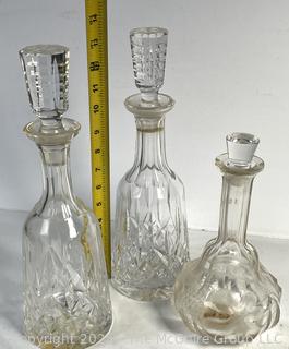 Three (3) Liquor Decanters Including one Waterford