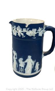 Two (2) English Wedgwood Cobalt Blue Jasperware Jugs<br><br>Wendy Dan Hermione

<br><br>

Removal Options:<br><br> Sat (Nov 8) & Sun (Nov 9) 11-3pm, 56 Scotch Hill Rd., Cambridge NY 12816<br><br>

Sat (Nov 15) 12-2pm, TMG Warehouse, 2800 Juniper St., Fairfax, VA 22031<br><br>

Request Shipping (david@themcguiregroupllc.com)