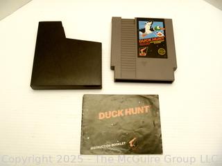 Nintendo Shooter and Two (2) Software Cartridges