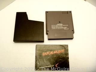 Nintendo Shooter and Two (2) Software Cartridges