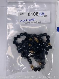 Onxy Opera Length Bead Necklace with Gold Bead Spacers