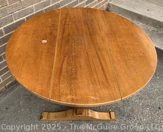 Round Drop Leaf Coaching Table with Lyre-Shaped Swivel Supports.  36" diameter