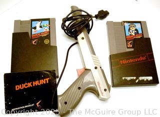 Nintendo Shooter and Two (2) Software Cartridges