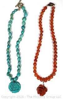 Two (2) Bead Necklaces with Carved Flower Pendants