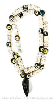 Puka Bead Necklace with African Trade Beads and Carved Pendant