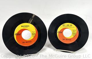 Two (2) Beatles 45 RPM Vinyl Records by Capital Records Including Matchbos, And I Love Her, Slow Down, and If I Fell.