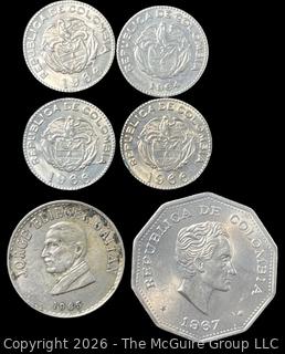 Six (6) Foreign coins in plastic holders, various dates and denominations. Columbia