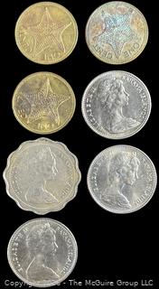 Seven (7) Foreign coins in cardboard holders, various dates and denominations. Bahamas