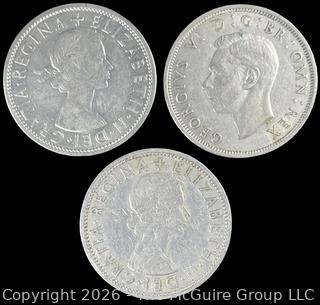 Three (3) Foreign coins in plastic holders, various dates and denominations. Great Britain