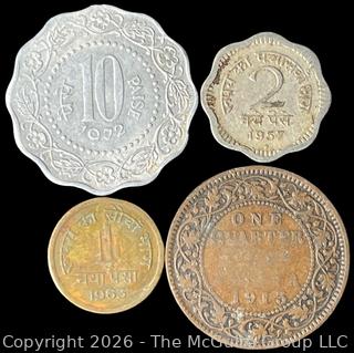 Four (4) Foreign coins in plastic holders, various dates and denominations. India