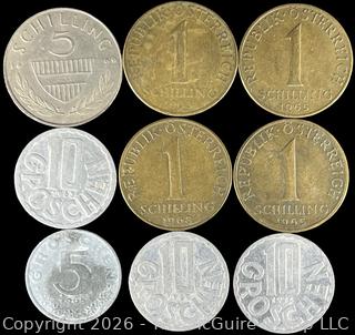 Nine (9) Foreign coins in cardboard holders, various dates and denominations. Austria