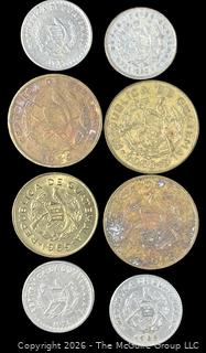 Eight (8) Foreign coins, various dates and denominations: Guatemala 