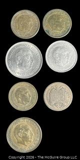 Seven (7) foreign coins, various dates and denominations: Spain