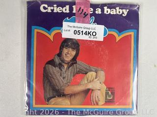 Collectable vinyl 45 rpm records with picture sleeves: