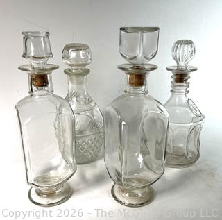 Four (4) Clear Glass Decanters