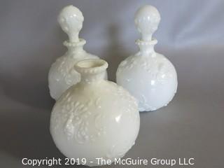 Milk-glass: Three embossed decanters, two with stoppers