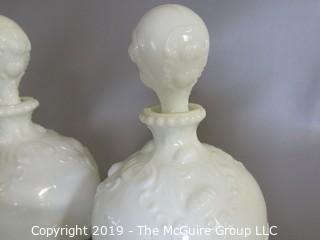 Milk-glass: Three embossed decanters, two with stoppers