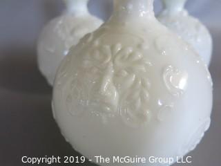 Milk-glass: Three embossed decanters, two with stoppers