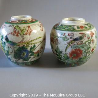 Two Oriental Ginger Jars w/ wood lids and wood bases (one damaged)