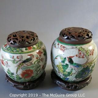 Two Oriental Ginger Jars w/ wood lids and wood bases (one damaged)