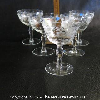 Five etched stemmed glasses