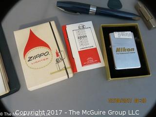 Collection including aeronautical vest-pocket handbook, zippo lighter, writers editing tool, drafting tools, Cross pen and pencil st, collectible pins men's wristwatch and (2) fountain pens 