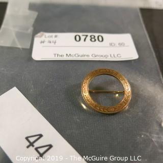 Jewelry: Circle pin, 14K Yellow gold delicately etched with laurel leaves, 1"; 2.4 grams (TMG 780)