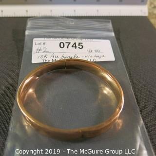 Jewelry: Vintage 10K Rose gold bangle with etched daisy, monogrammed, 65 x 57 mm, moderate wear; 13.1 grams. (TMG 745)