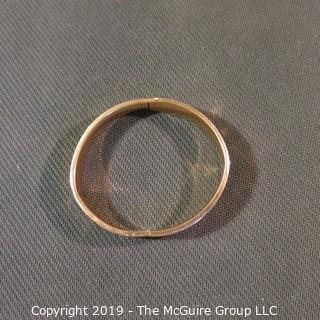 Jewelry: Vintage 10K Rose gold bangle with etched daisy, monogrammed, 65 x 57 mm, moderate wear; 13.1 grams. (TMG 745)