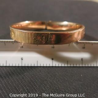 Jewelry: Vintage 10K Rose gold bangle with etched daisy, monogrammed, 65 x 57 mm, moderate wear; 13.1 grams. (TMG 745)