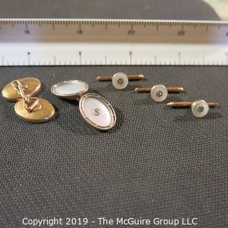 Jewelry: Men’s 14K Yellow gold, 18x13mm oval mother of pearl with 3 point diamond studded cufflinks and matching studs for 3 button holes; total weight 11.3 grams. (TMG 0755)