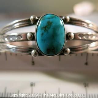 Jewelry: Fred Harvey Style Navajo Cuff with 12 x 17 mm bezel set turquoise cabochon. No hallmark, but likely Sterling or coin silver.