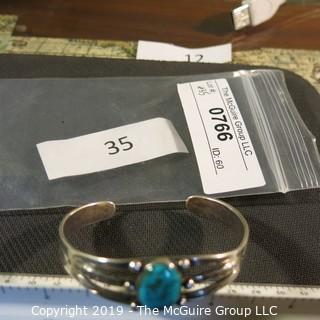 Jewelry: Fred Harvey Style Navajo Cuff with 12 x 17 mm bezel set turquoise cabochon. No hallmark, but likely Sterling or coin silver.