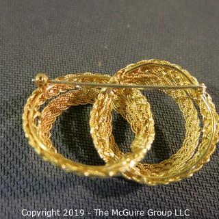 Jewelry: Entwined Double Circle brooch, braided rope motif, 49 x 33 mm, 18K Yellow gold; 15.2 grams (Italy); (TMG 781)